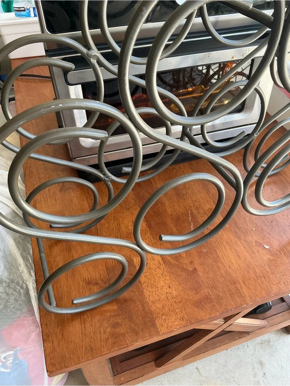 This is Vintage iron wine rack features a heavy scroll design and holds 8 bottle